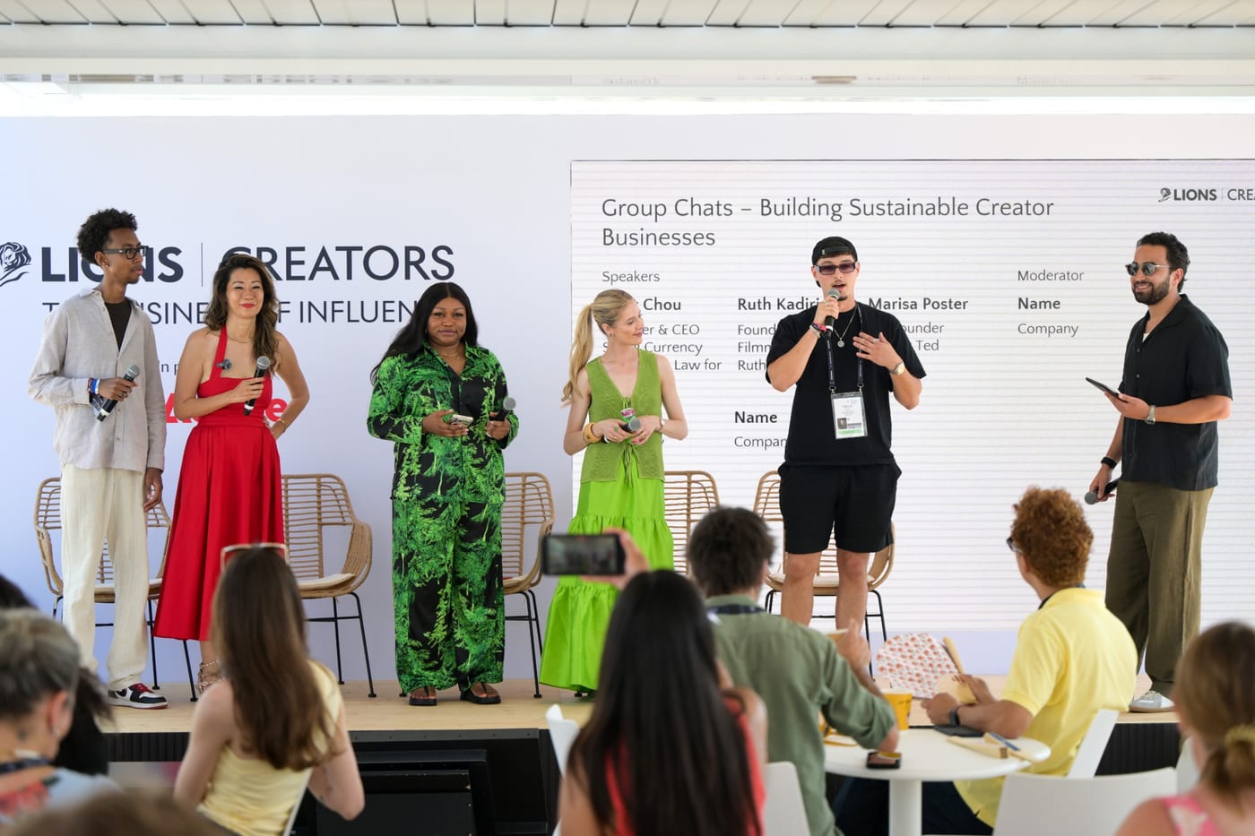 Tyler Chou and fellow panelists standing on stage before an audience at the LIONS Creators stage, Cannes Lions 2026.