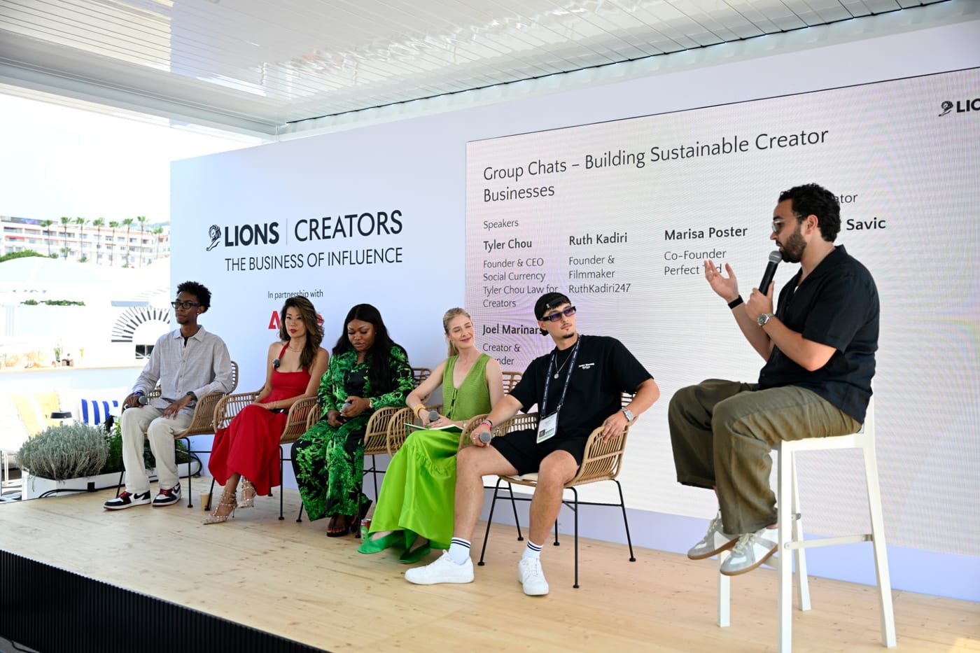 The 'Group Chats – Building Sustainable Creator Businesses' panel seated on stage as the moderator speaks, Cannes Lions 2026.